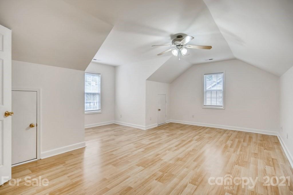 1512 Mineral Springs Road Charlotte, NC 28262 - Photo 17 of 19 a view of empty room with wooden floor and fan
