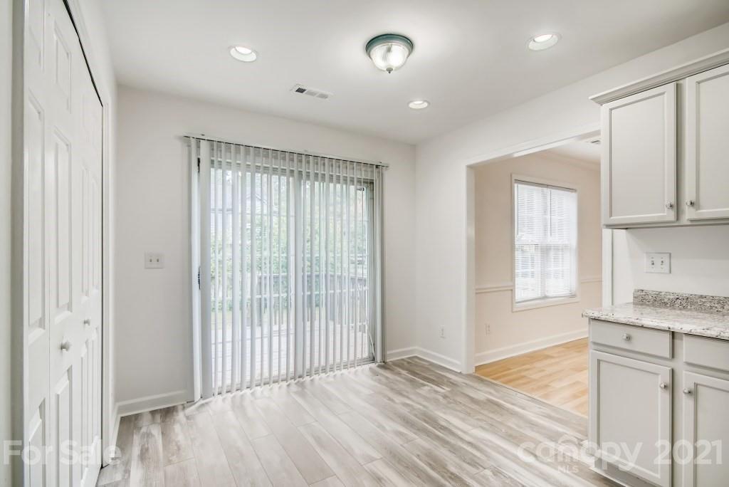 1512 Mineral Springs Road Charlotte, NC 28262 - Photo 8 of 19 a view of a kitchen with wooden floor and a window