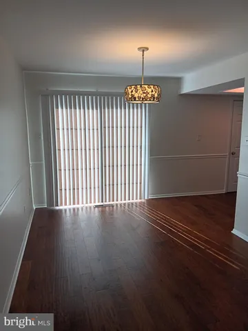 an empty room with wooden floor