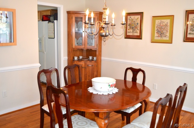 9606 Dunroming Road Chesterfield, VA 23832 - Photo 7 of 19 a view of a dining room with furniture and chandelier