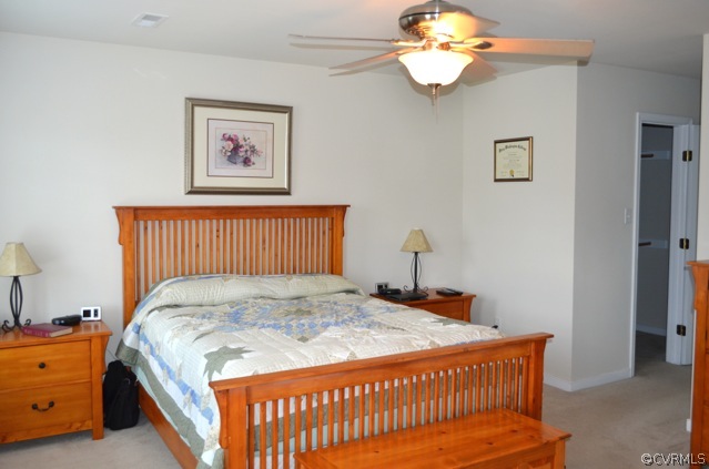 9606 Dunroming Road Chesterfield, VA 23832 - Photo 8 of 19 a bedroom with a bed and a chandelier