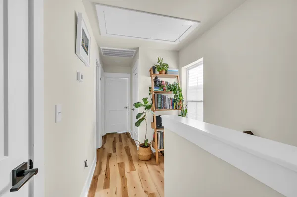 a dining room with furniture and a wooden floor