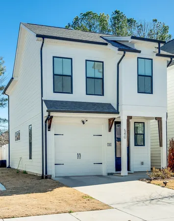 a front view of a house with garage