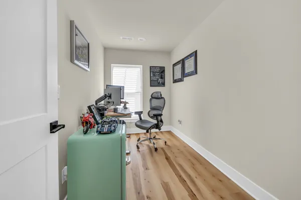 a view of a livingroom with furniture and a window