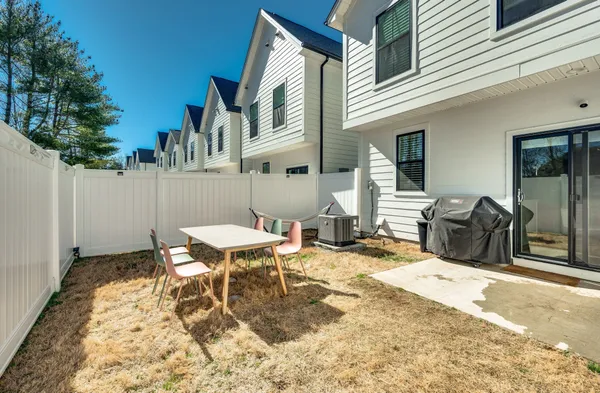 a view of a patio with a table and chairs in patio