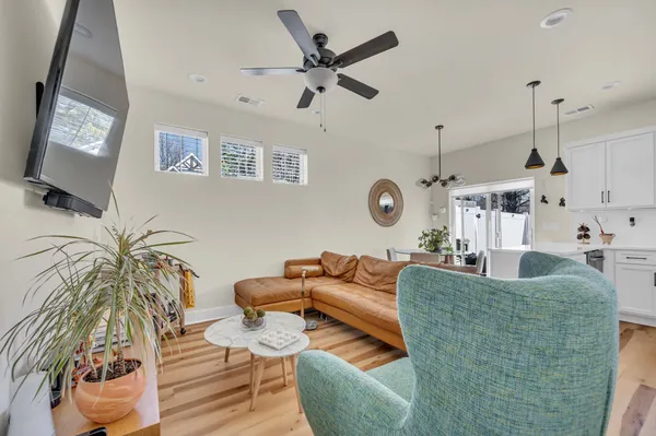 a living room with furniture and a large window