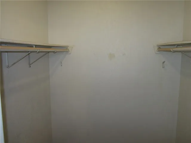 a view of a room with racks on the wall
