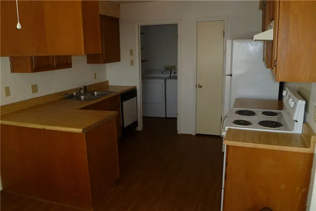 a kitchen with a stove and a refrigerator