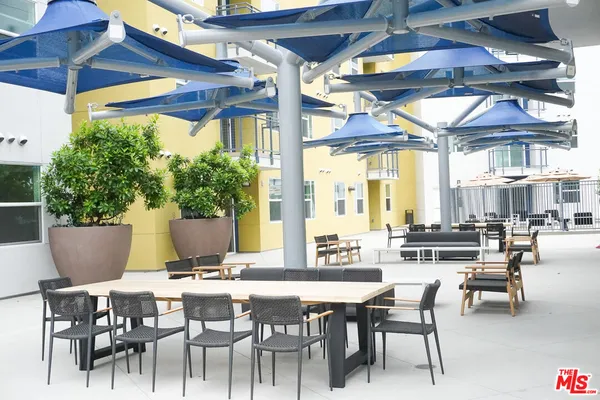 a view of a living room and kitchen floor