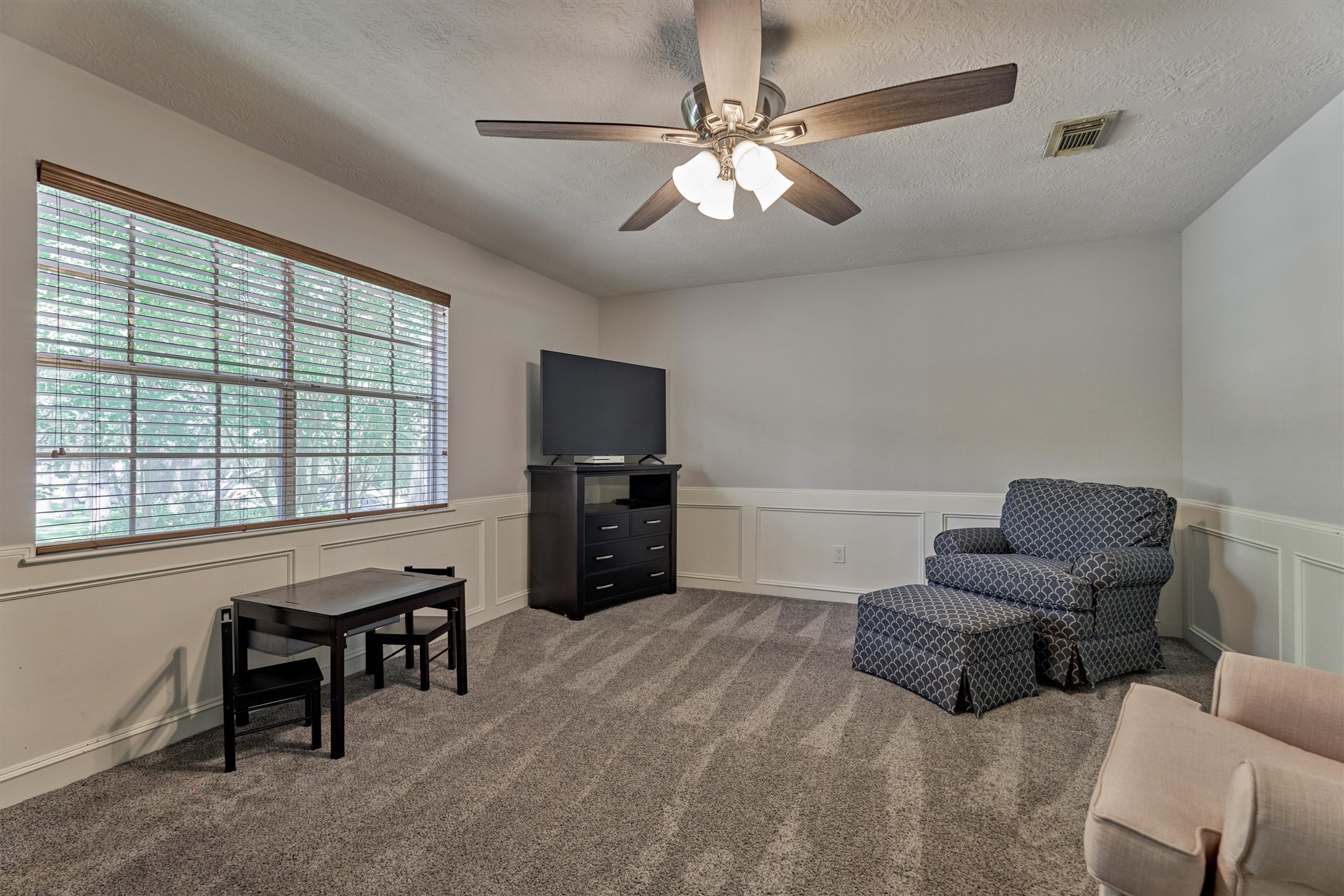 6522 Castle Pine Lane Spring, TX 77379 - Photo 37 of 49 a living room with furniture and a flat screen tv