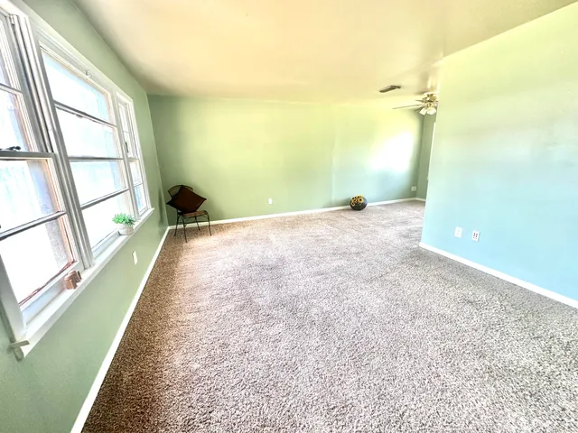 a view of a room with a large window