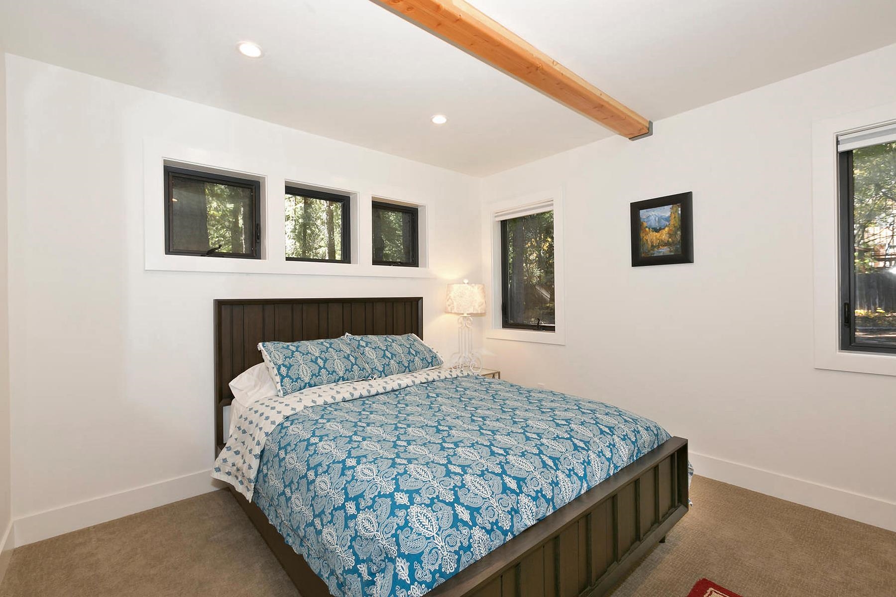 2648 Rustic Lane Homewood, CA 96141 - Photo 11 of 23 a bedroom with a bed and a night stand