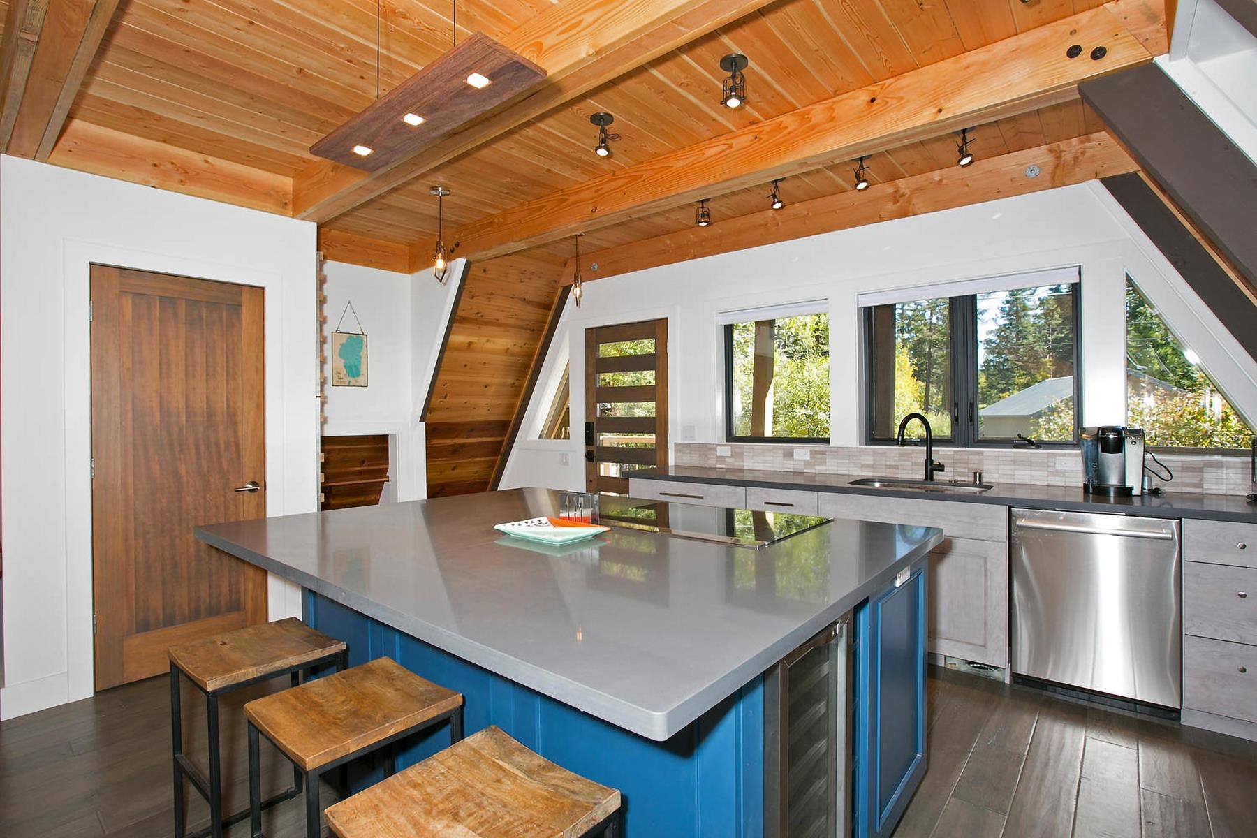 2648 Rustic Lane Homewood, CA 96141 - Photo 7 of 23 a kitchen with stainless steel appliances granite countertop a sink a counter space and wooden floors