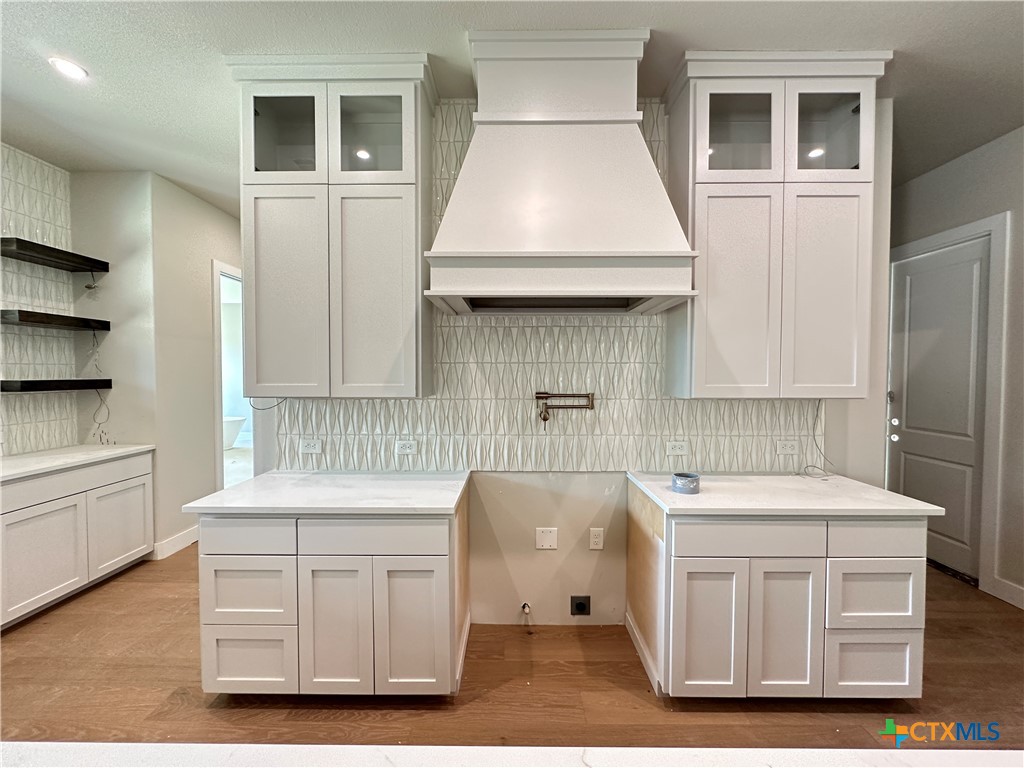 418 Dos Rios Drive Belton, TX 76513 - Photo 4 of 41 a kitchen with a sink stove and cabinets