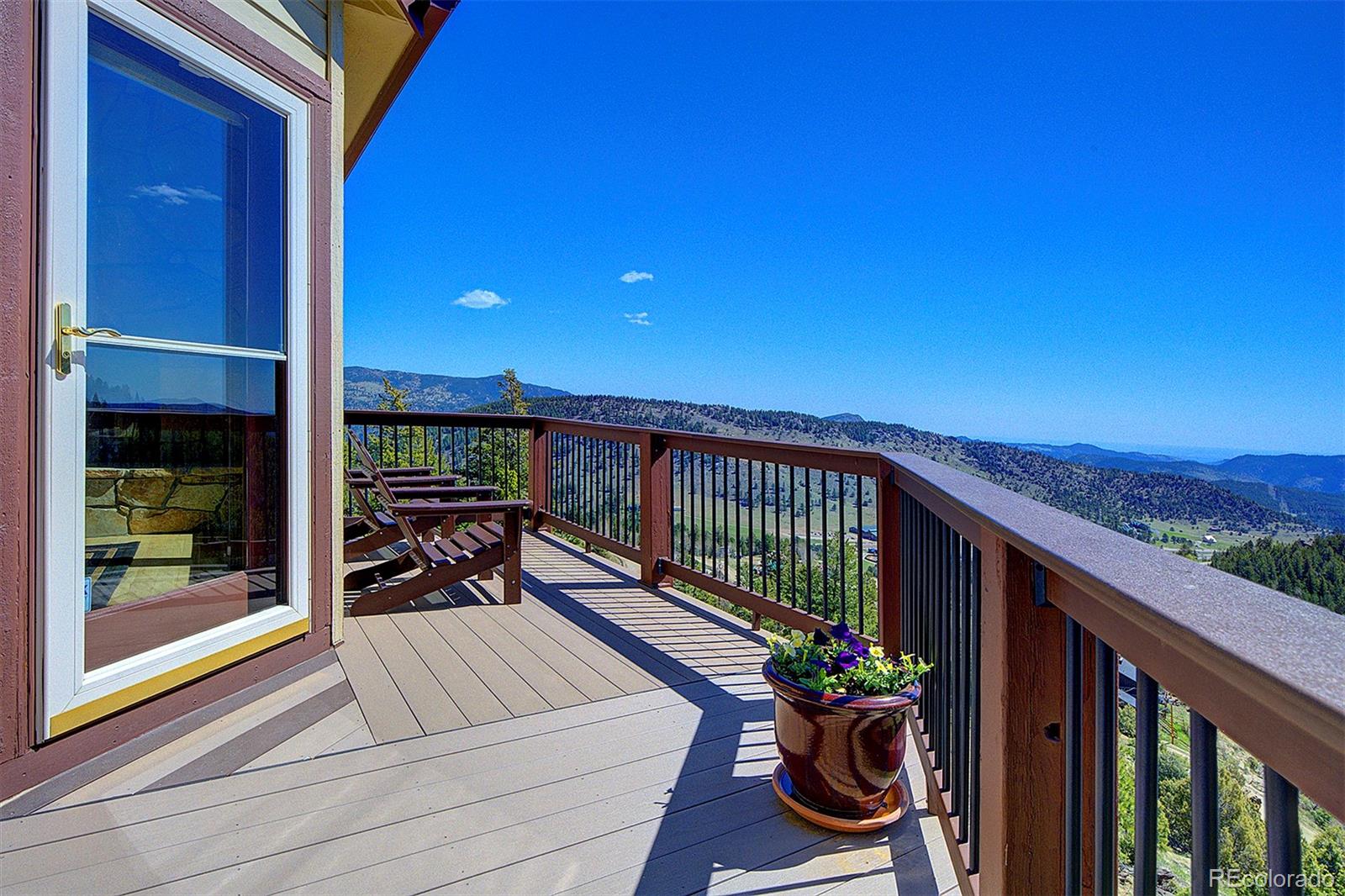a view of a balcony with chairs