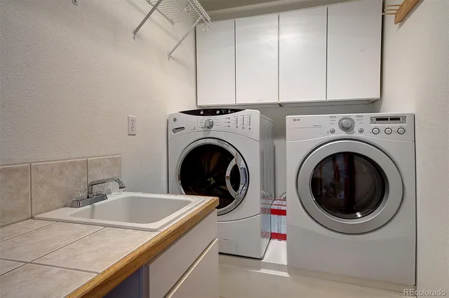 a bathroom with a sink a toilet and shower curtain