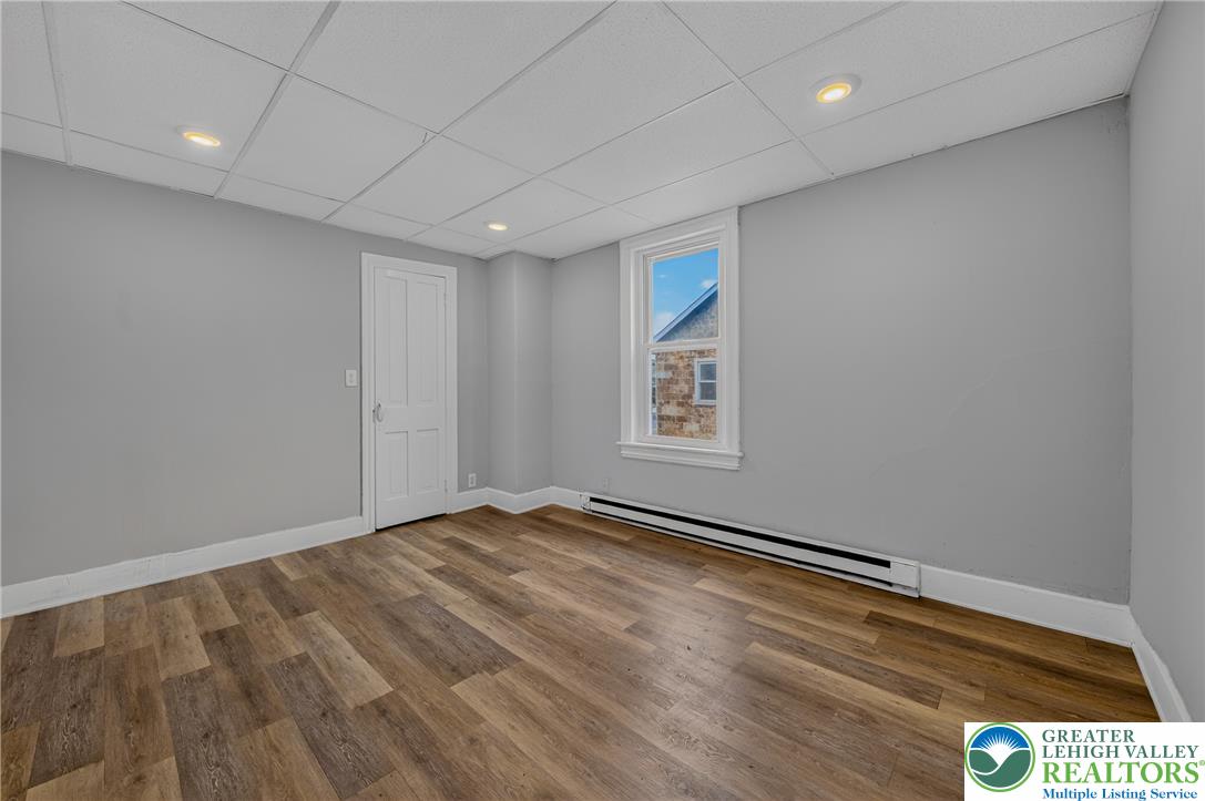 313 Main Street Slatington, PA 18080 - Photo 46 of 73 A well-proportioned bedroom showcases rich wood flooring and practical recessed lighting.