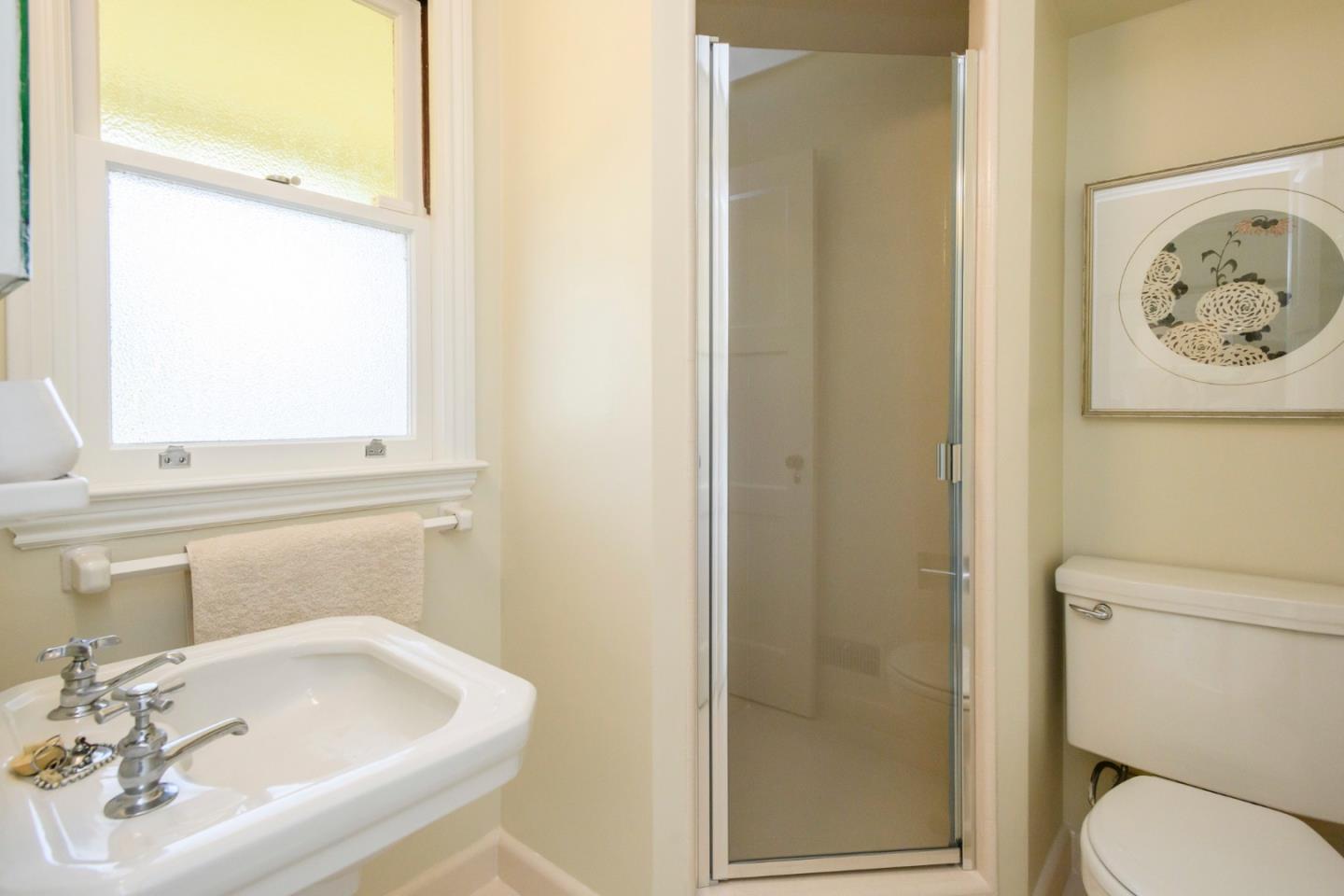 604 Parrott Drive San Mateo, CA 94402 - Photo 13 of 35 a bathroom with a sink and a mirror
