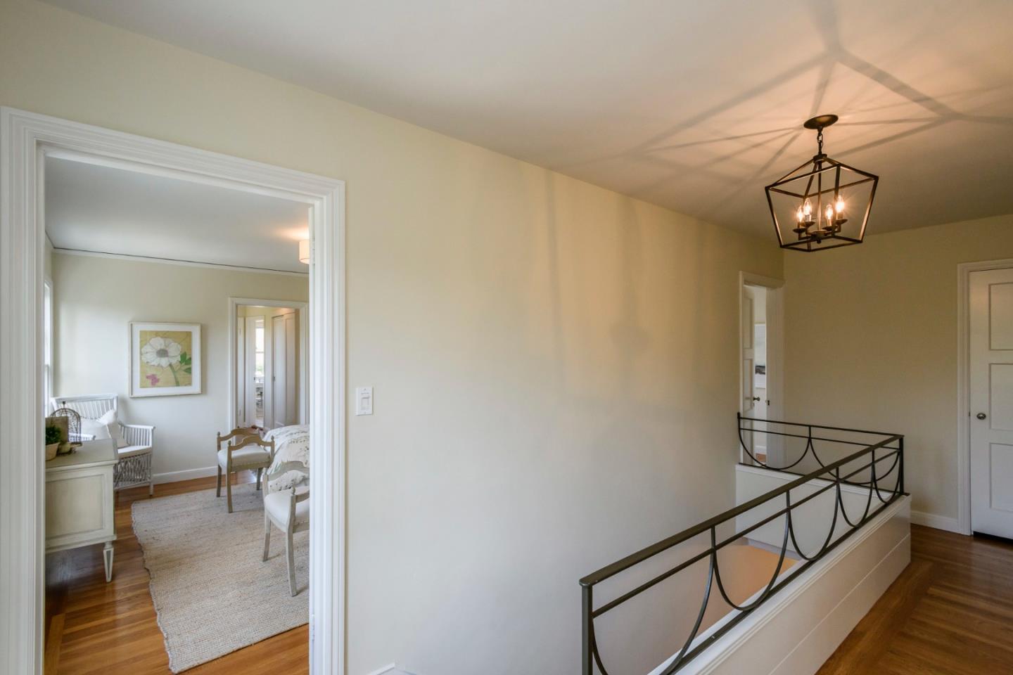 604 Parrott Drive San Mateo, CA 94402 - Photo 14 of 35 a view of a livingroom with a dinning area hardwood floor and a chandelier