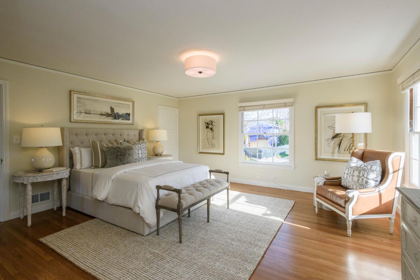 604 Parrott Drive San Mateo, CA 94402 - Photo 20 of 35 a bedroom with a bed and wooden floor