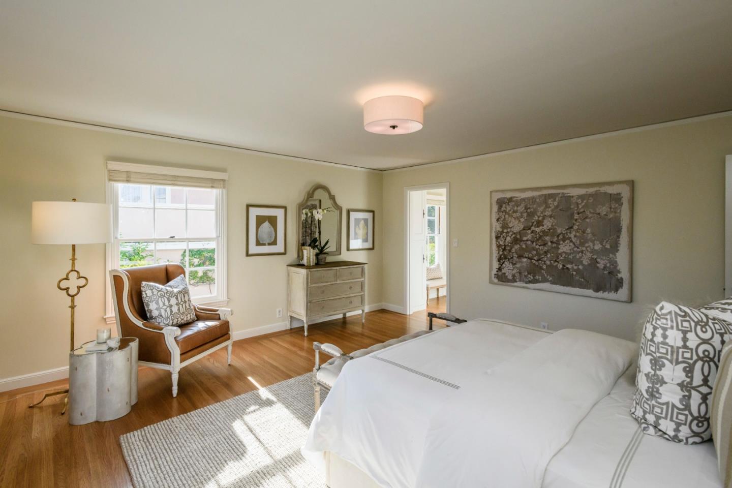 604 Parrott Drive San Mateo, CA 94402 - Photo 21 of 35 a bedroom with a bed and wooden floor