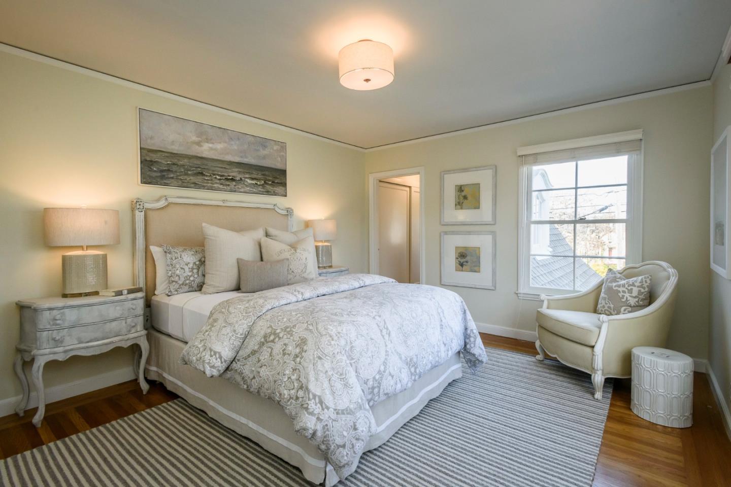 604 Parrott Drive San Mateo, CA 94402 - Photo 23 of 35 a bedroom with a bed and wooden floor