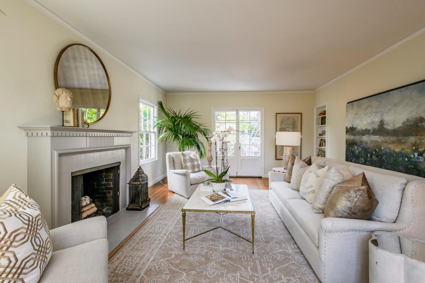 604 Parrott Drive San Mateo, CA 94402 - Photo 4 of 35 a living room with furniture a fireplace and a floor to ceiling window