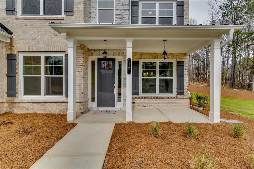 12 Overview Court Hoschton, GA 30548 - Photo 2 of 18 a house view with a outdoor space