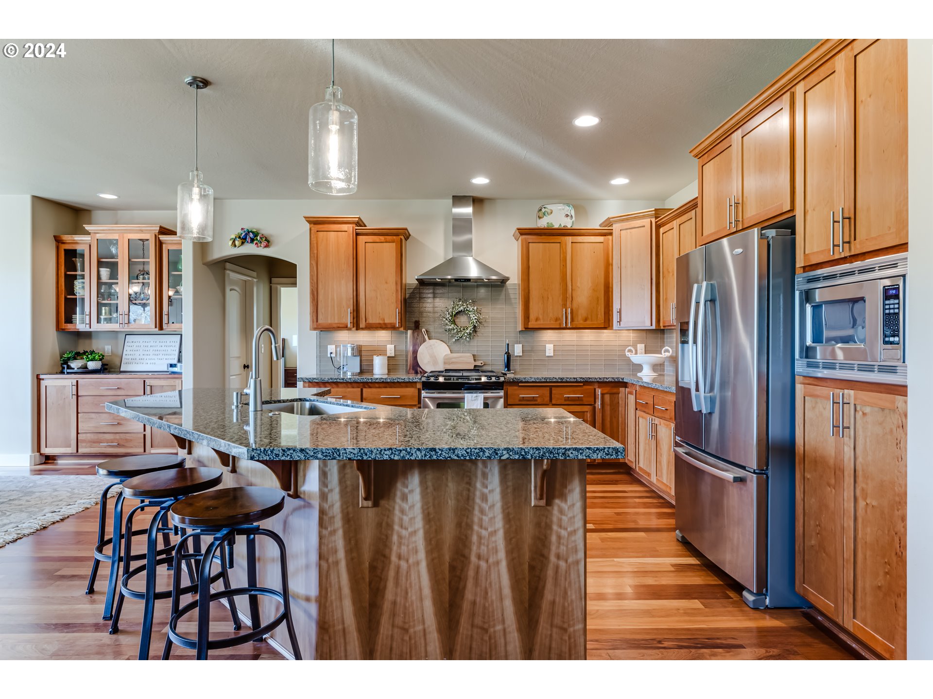 6234 Graystone Loop Springfield, OR 97478 - Photo 18 of 43 a kitchen with counter top space cabinets and stainless steel appliances