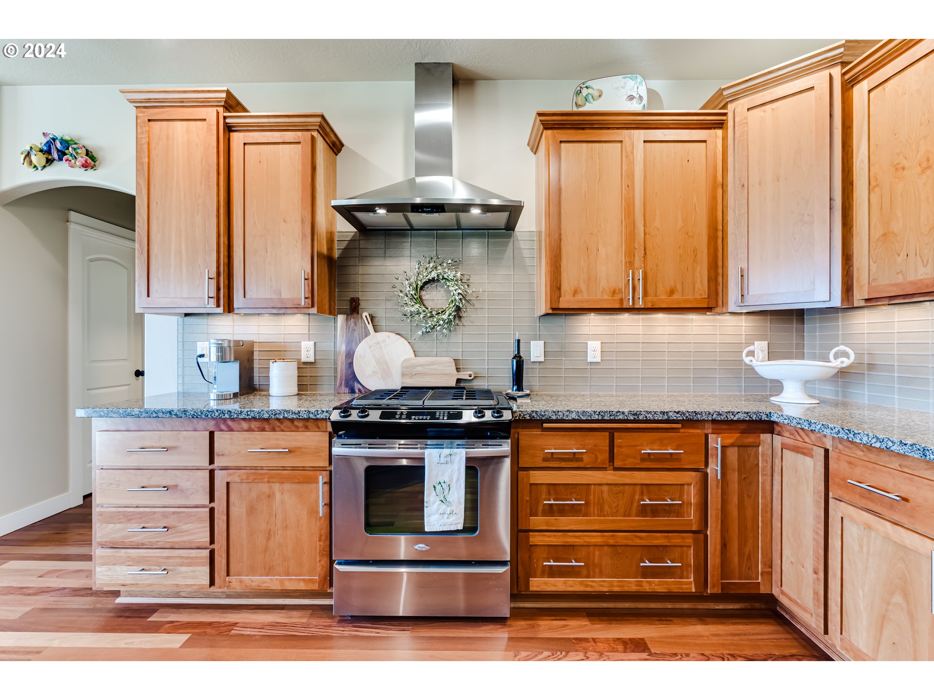 6234 Graystone Loop Springfield, OR 97478 - Photo 21 of 43 a kitchen with stainless steel appliances granite countertop a stove and a cabinets
