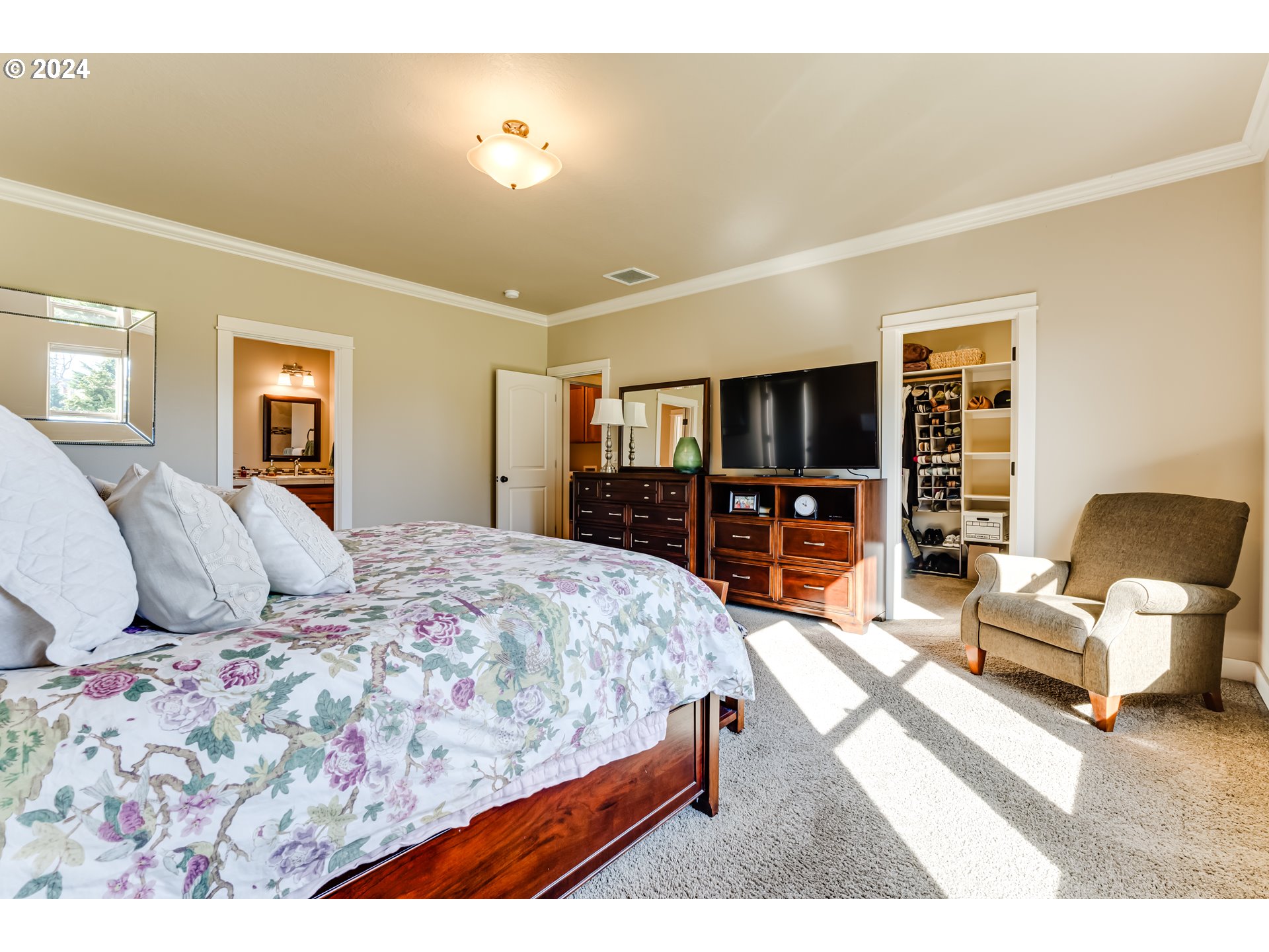 6234 Graystone Loop Springfield, OR 97478 - Photo 26 of 43 a bedroom with a large bed and a flat screen tv