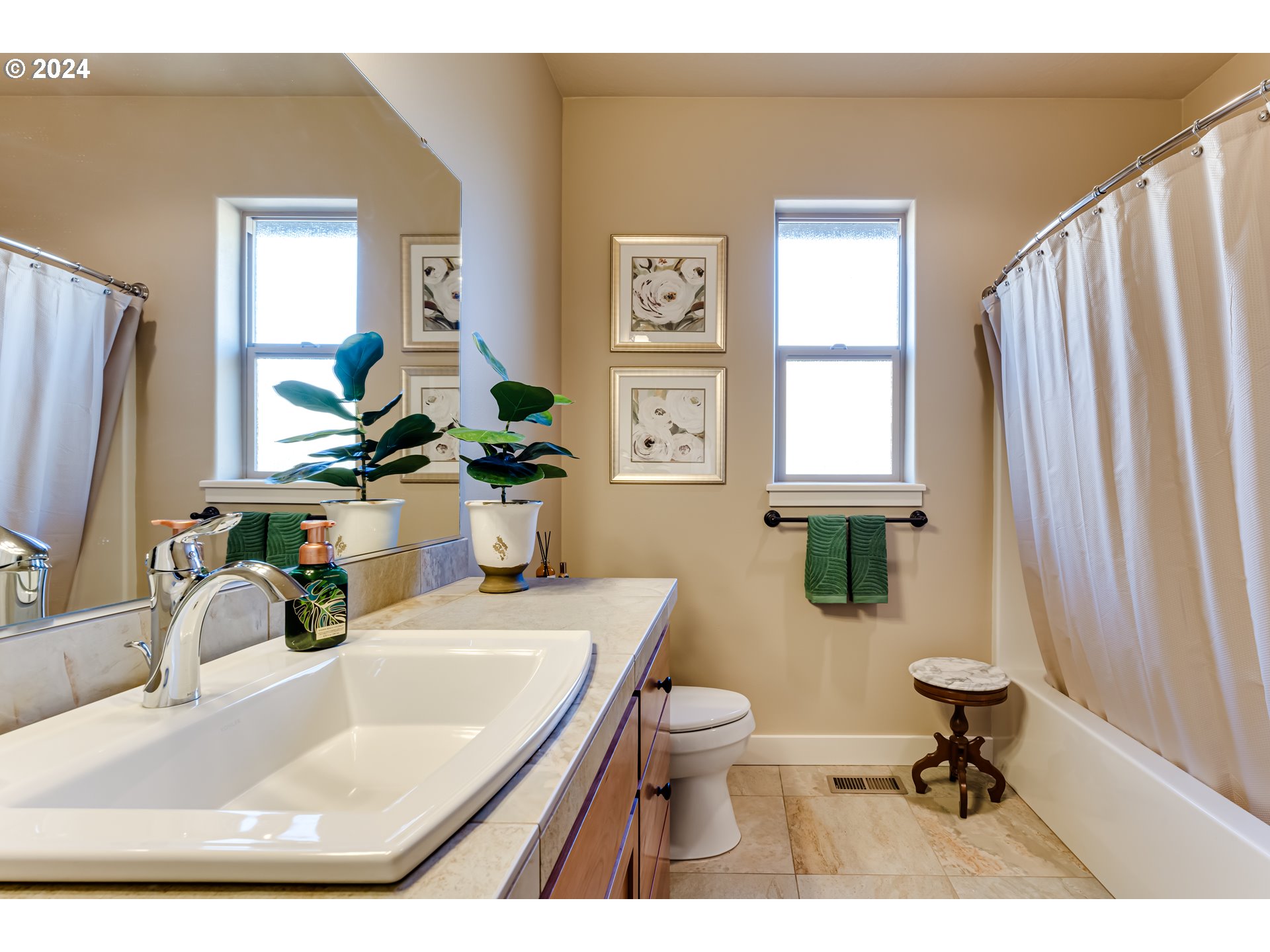6234 Graystone Loop Springfield, OR 97478 - Photo 31 of 43 a bathroom with a sink a toilet and a mirror