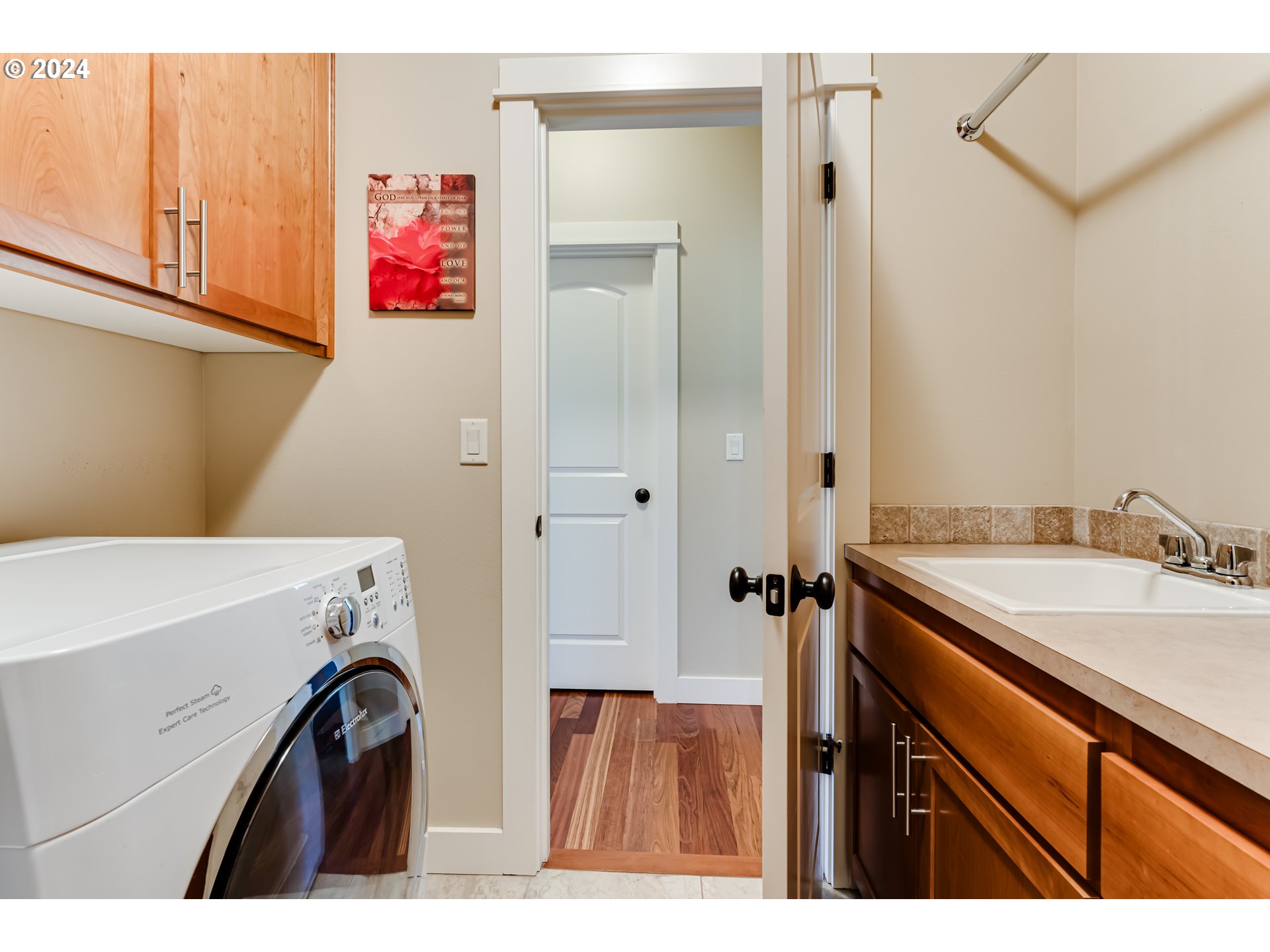 6234 Graystone Loop Springfield, OR 97478 - Photo 33 of 43 a utility room with cabinets washer and dryer