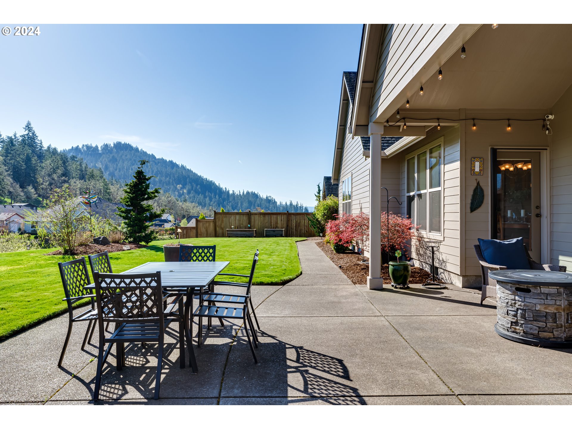 6234 Graystone Loop Springfield, OR 97478 - Photo 34 of 43 a view of a patio with a table and chairs