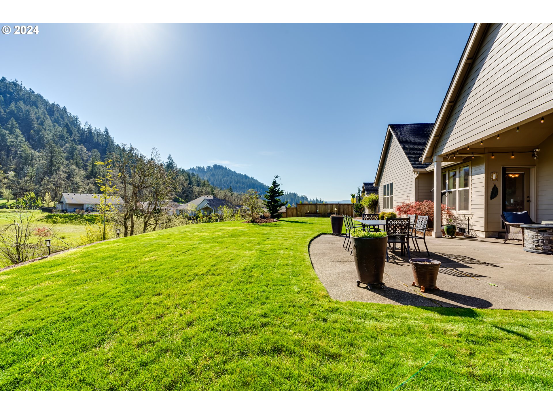 6234 Graystone Loop Springfield, OR 97478 - Photo 35 of 43 a view of a house with a yard and sitting area