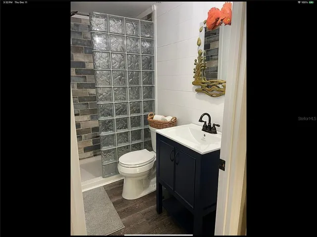 a view of a bathroom from a hallway