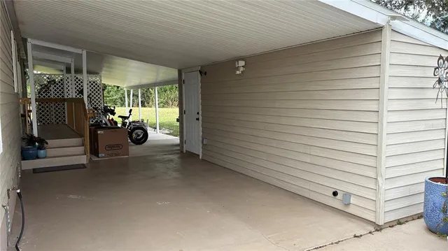 a view of a brick house with large windows