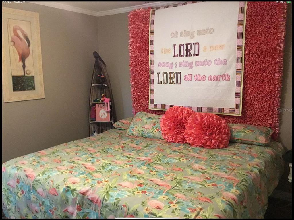 90 Whipporwill Court Ellenton, FL 34222 - Photo 22 of 34 a bedroom with a bed and a painting on the wall