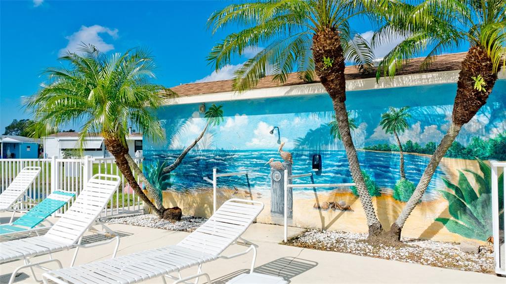 90 Whipporwill Court Ellenton, FL 34222 - Photo 34 of 34 a view of a palm tree with wooden fence