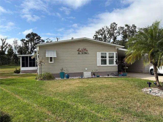 a view of a house with a big yard