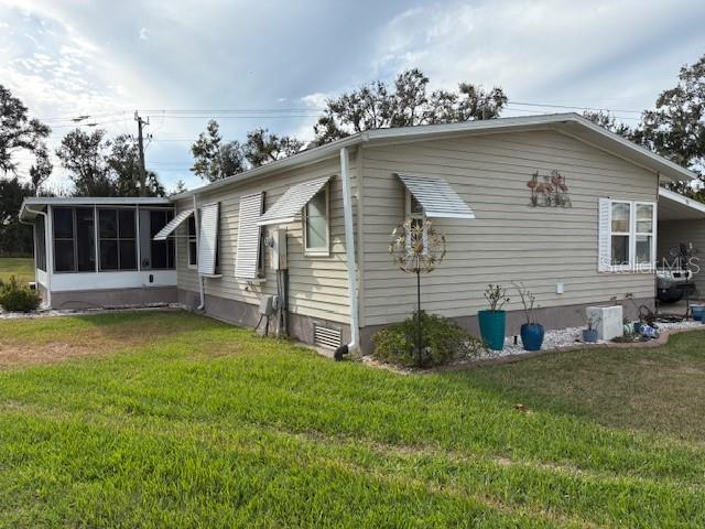 90 Whipporwill Court Ellenton, FL 34222 - Photo 7 of 34 a view of a house with a yard and sitting area