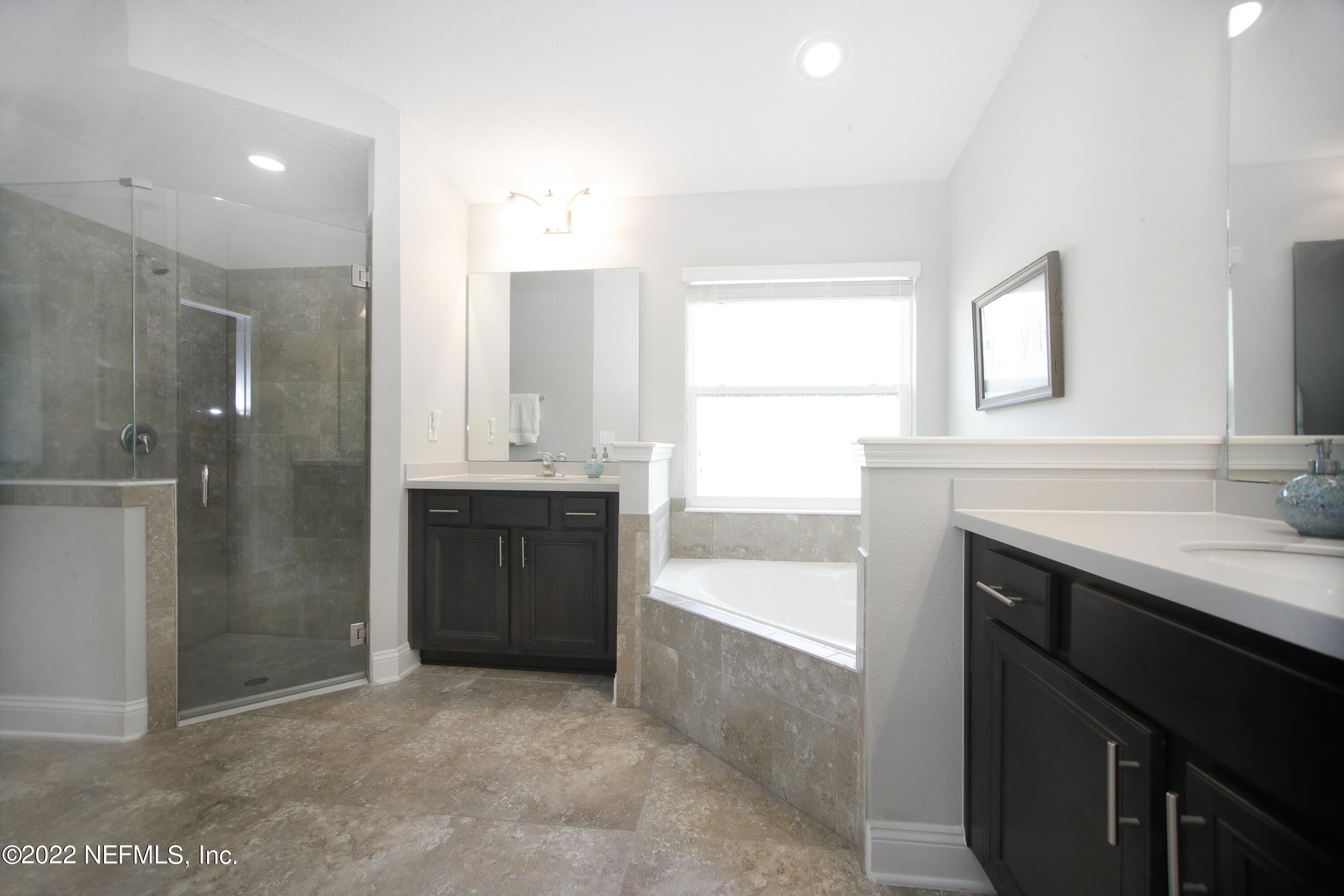 900 Deer Crossing Road St. Augustine, FL 32086 - Photo 11 of 29 a bathroom with a sink and a mirror