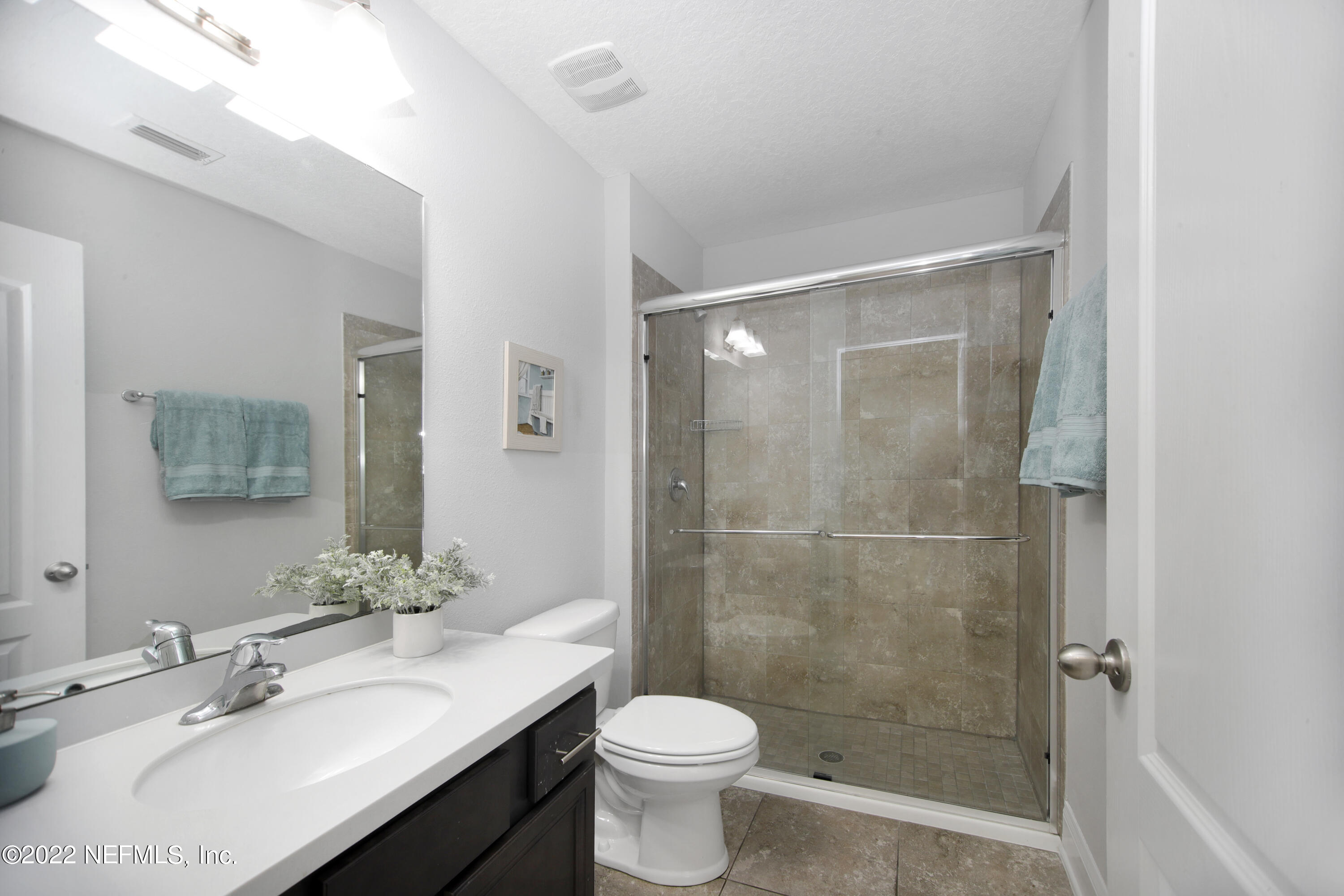 900 Deer Crossing Road St. Augustine, FL 32086 - Photo 15 of 29 a bathroom with a sink toilet and shower
