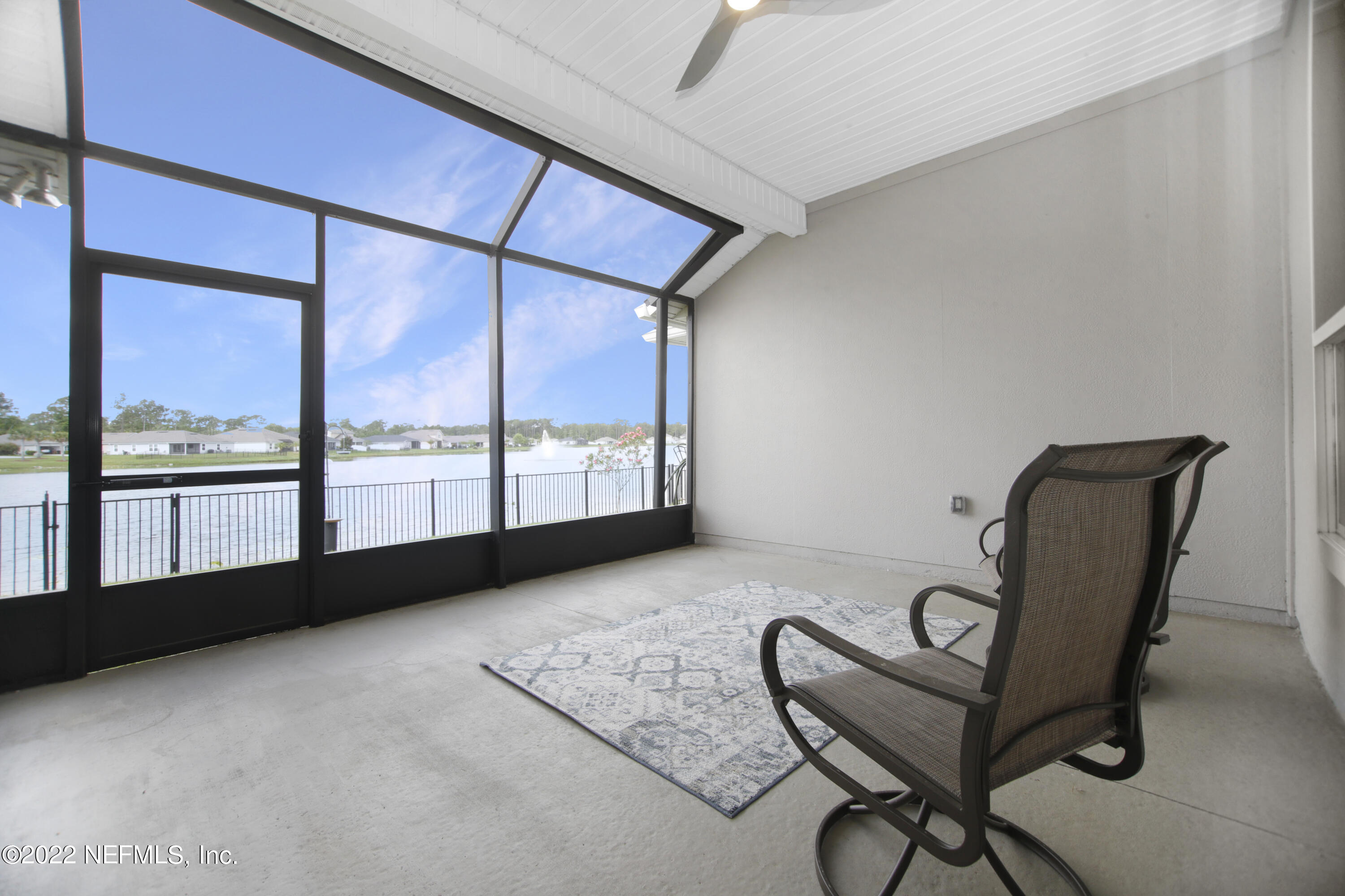900 Deer Crossing Road St. Augustine, FL 32086 - Photo 18 of 29 a view of a room with gym equipment and large windows