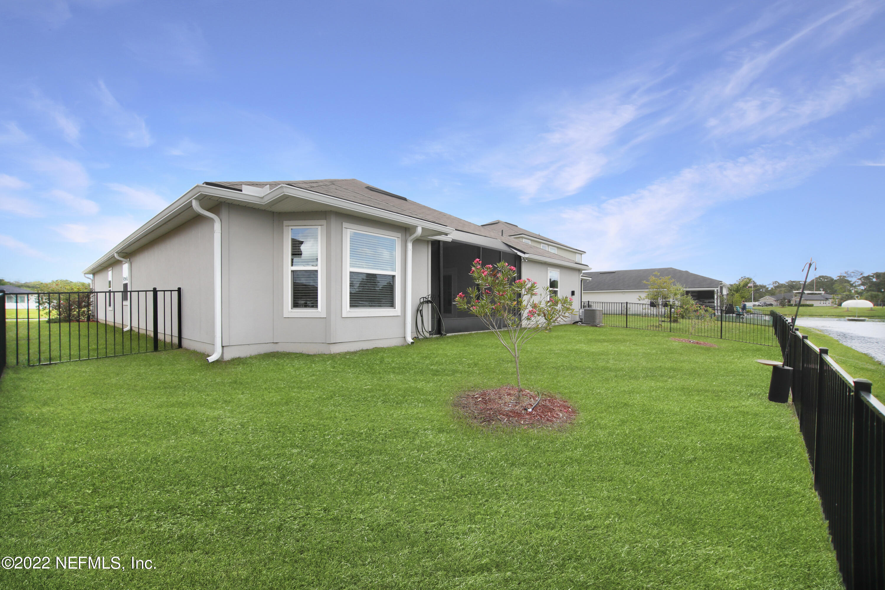 900 Deer Crossing Road St. Augustine, FL 32086 - Photo 19 of 29 a front view of a house with a garden