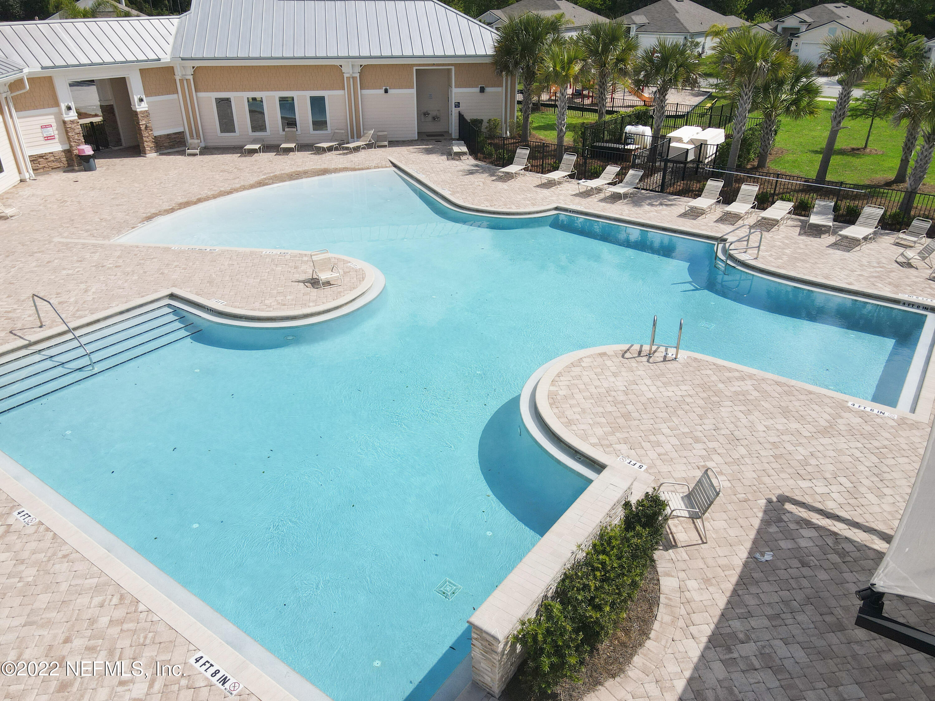 900 Deer Crossing Road St. Augustine, FL 32086 - Photo 22 of 29 a view of a swimming pool with outdoor seating