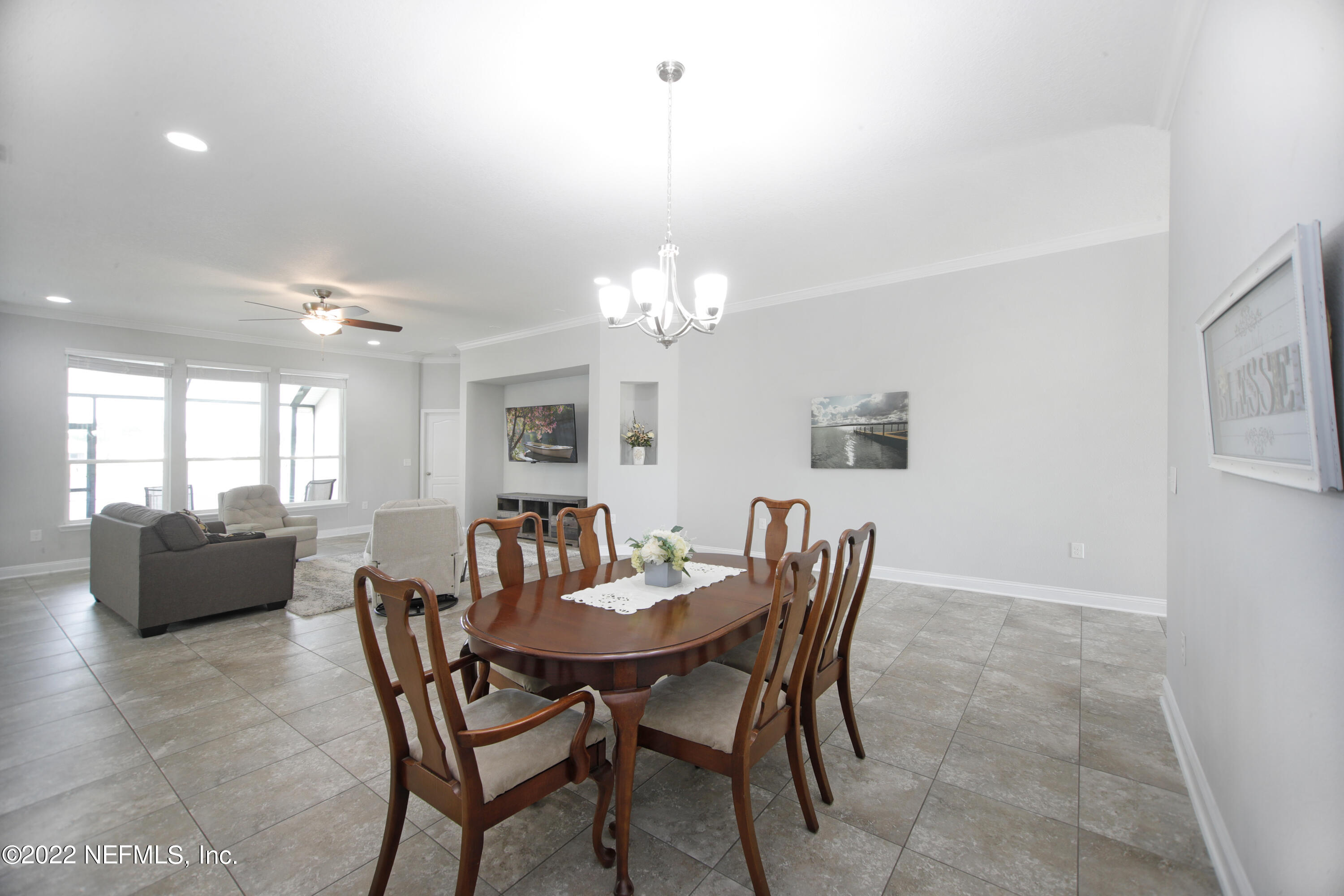 900 Deer Crossing Road St. Augustine, FL 32086 - Photo 4 of 29 a view of a dining room with furniture and chandelier