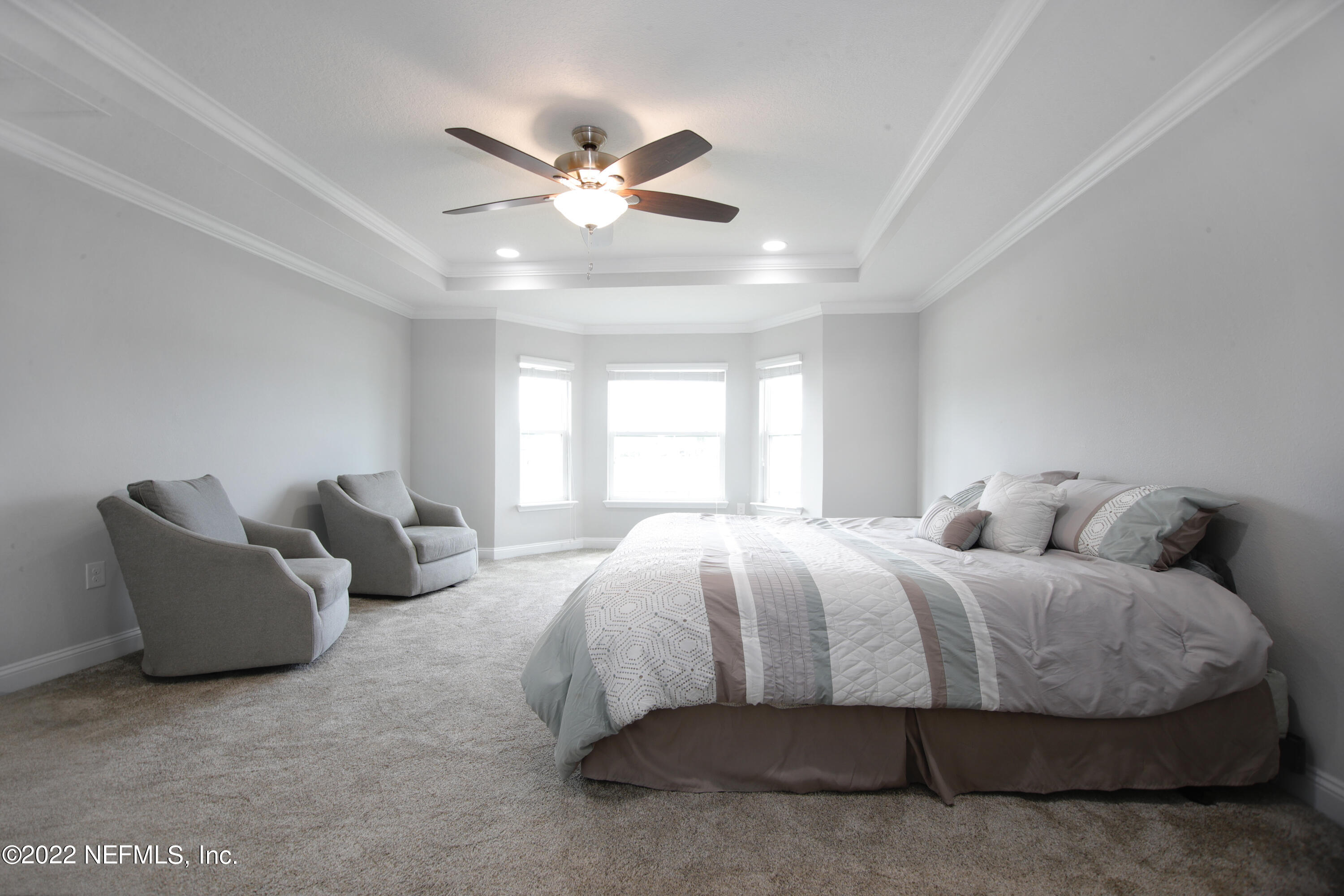 900 Deer Crossing Road St. Augustine, FL 32086 - Photo 8 of 29 a bedroom with bed and window