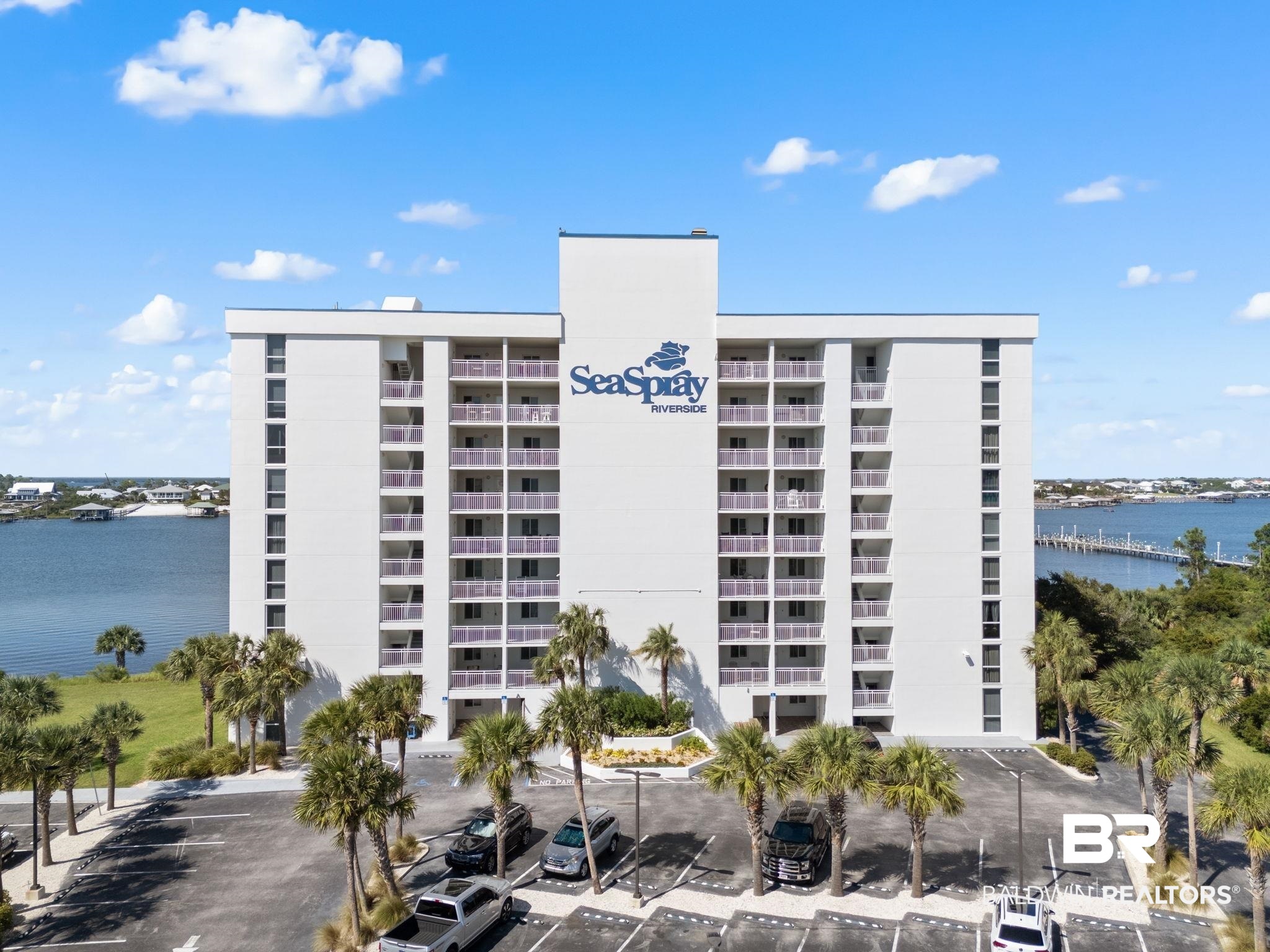 16284 Perdido Key Drive, Unit 912 Perdido Key, FL 32507 - Photo 1 of 49 View of apartment building / complex featuring a water view and uncovered parking