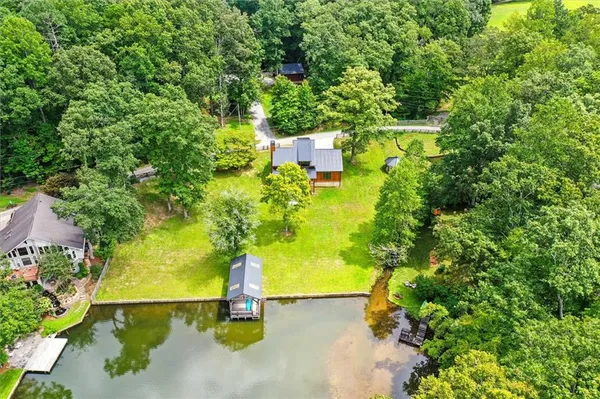 an aerial view of residential house with outdoor space and swimming pool